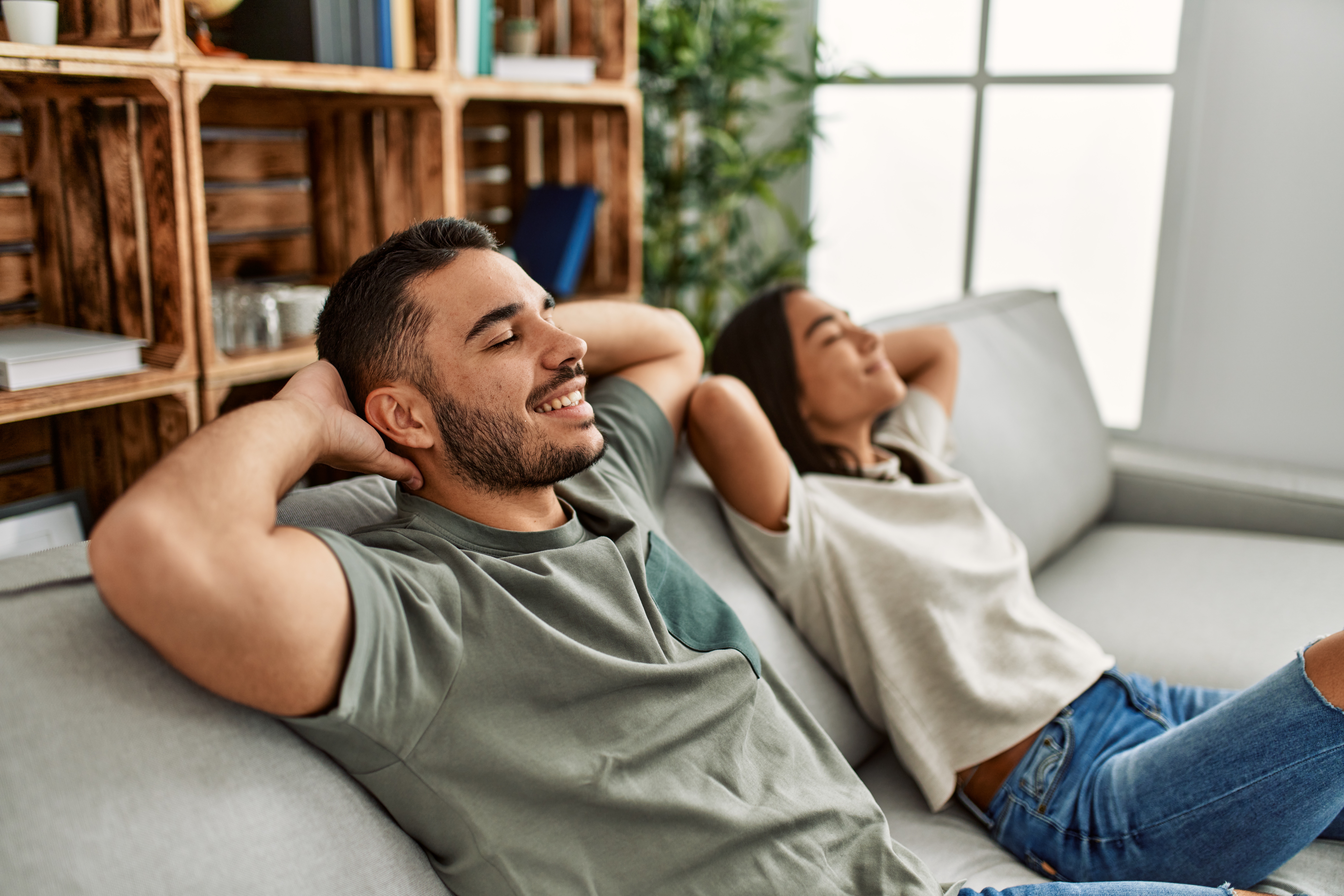 Couple relaxing in living room